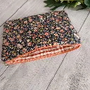 Neceser de viaje plano con cremallera y diseño floral